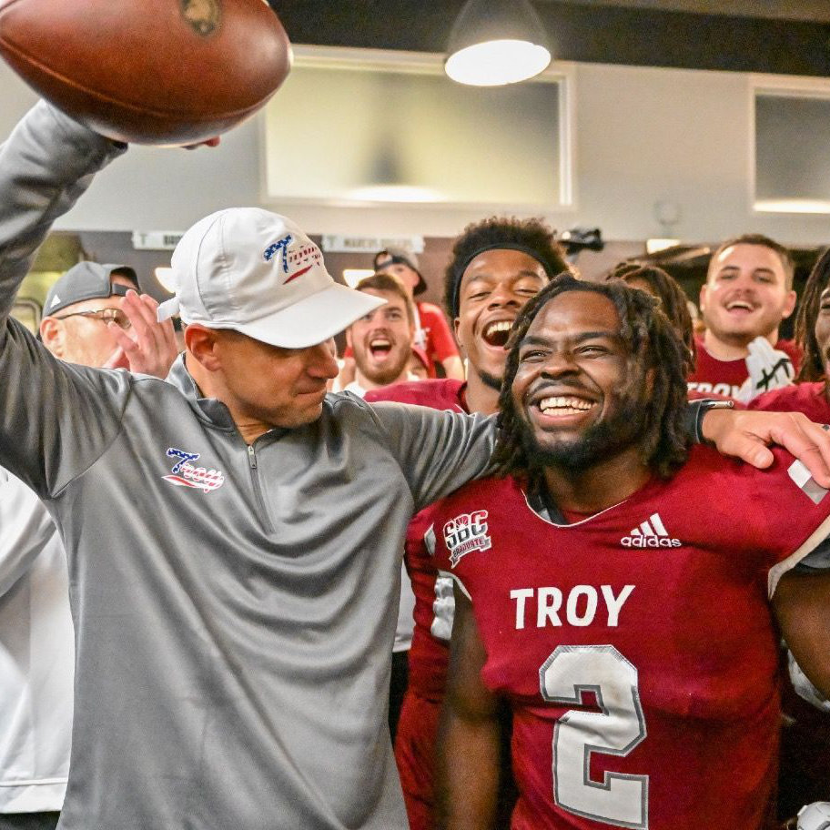 Carlton Martial celebrates with Coach Sumrall
